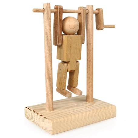 Handcrafted wooden acrobat toy made from fir and beech wood, featuring a manually rotatable acrobat for 360° movement. Dimensions: 8x14x19 cm.