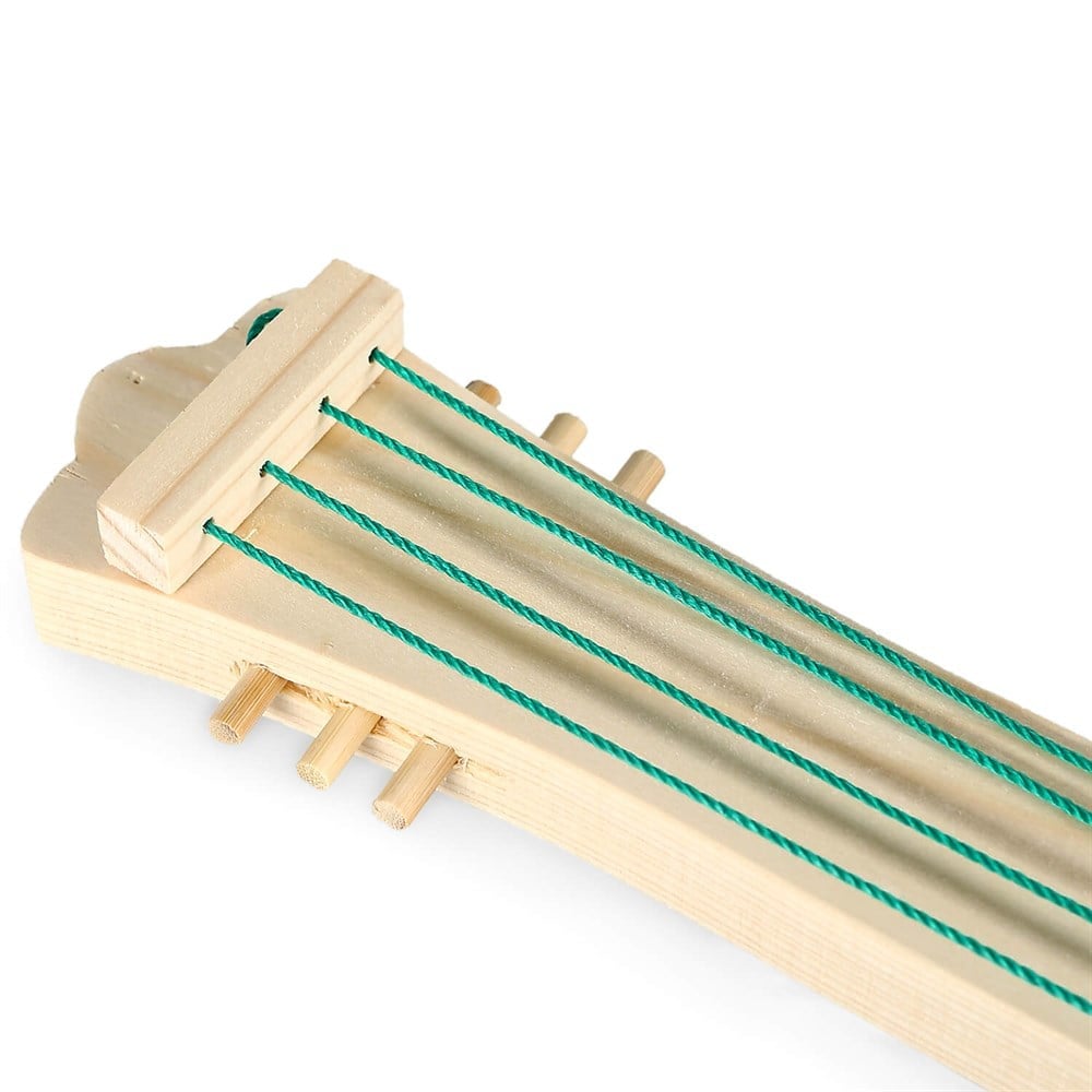 Handcrafted wooden toy guitar made from spruce wood, featuring colorful strings and a natural finish. Dimensions: 37x14x2 cm.