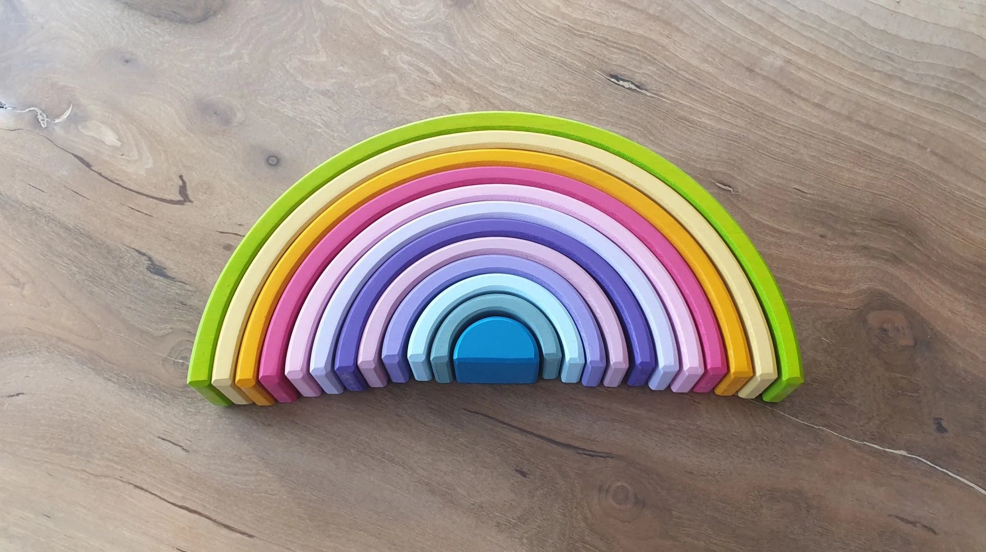 Pastel wooden rainbow arch set for Waldorf education
