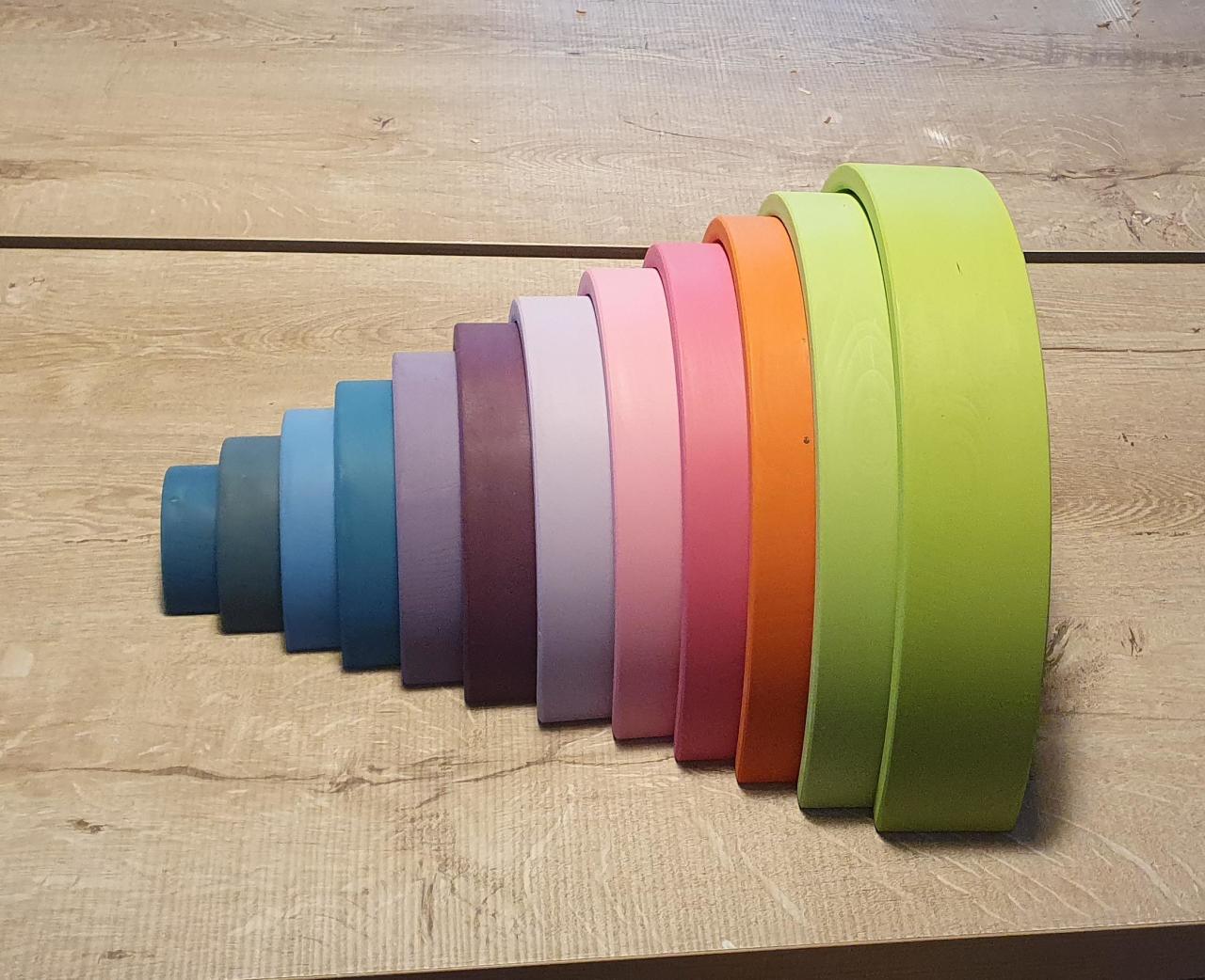 Pastel wooden rainbow curve stack for Waldorf education
