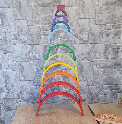 Stacked wooden rainbow arches for Waldorf education
