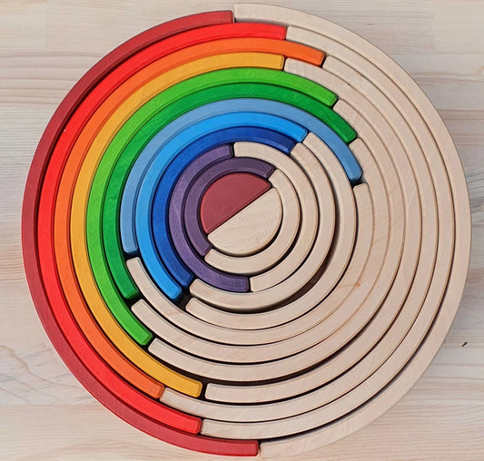 
Wooden rainbow stacking rings for Waldorf education
